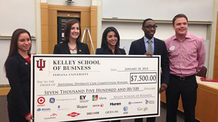 students with large check 
