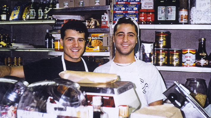 Emilio and Bill MIgnucci Jr. behind the counter of Di Bruno Bros. in 1990
