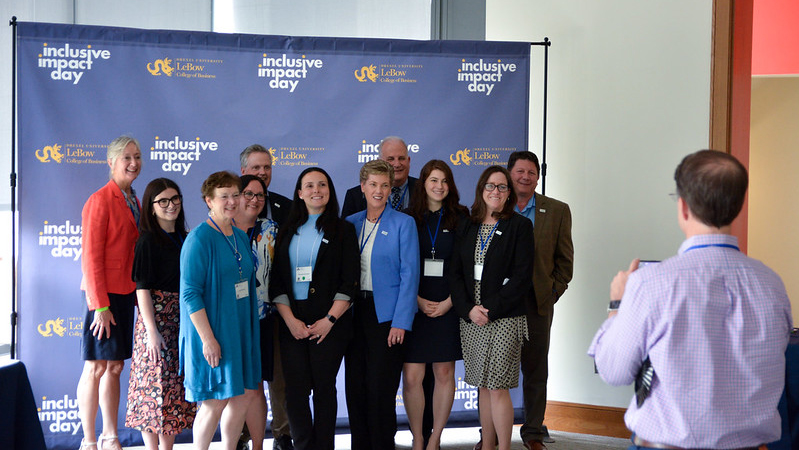 Inclusive Impact Day Guests pose for photo