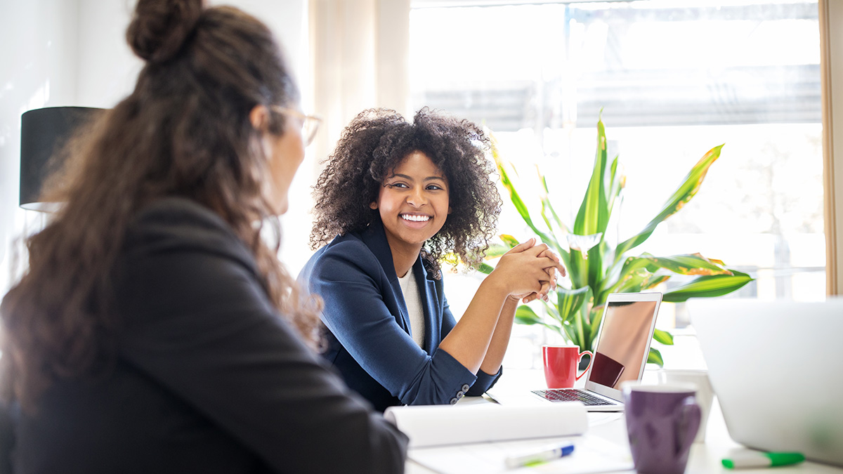 Drexel LeBow student talking to co-worker on Co-op