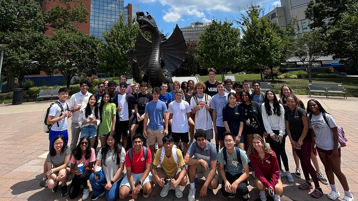 Drexel LeBow pre-college program students with Mario the Dragon