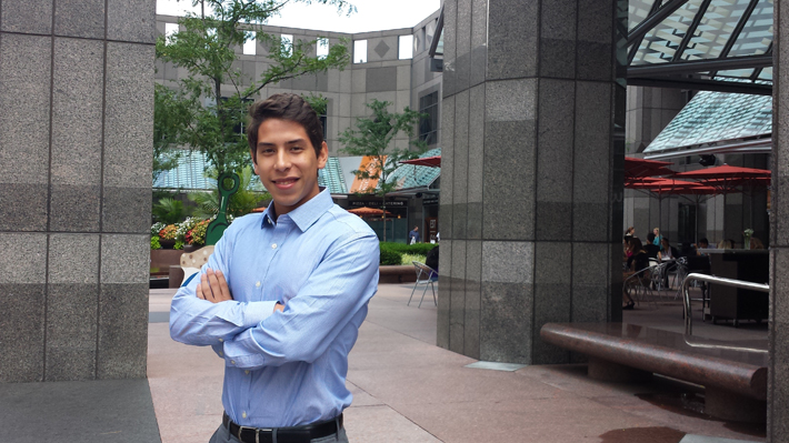 Andres posing on campus