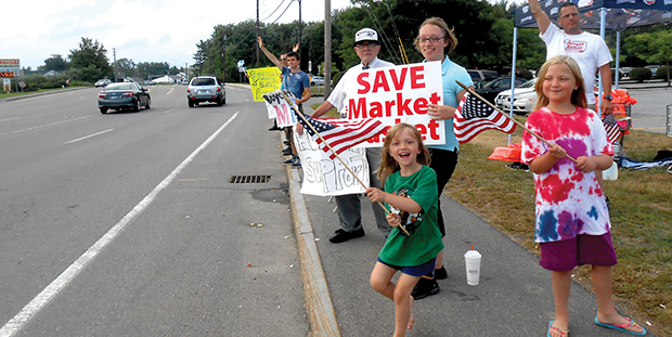 Protesters rally along side the road