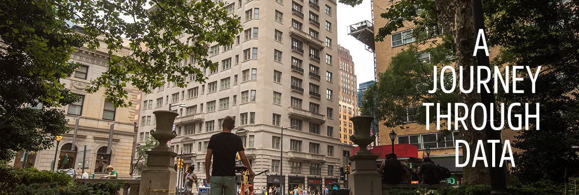 Man walking bike towards AKA Property