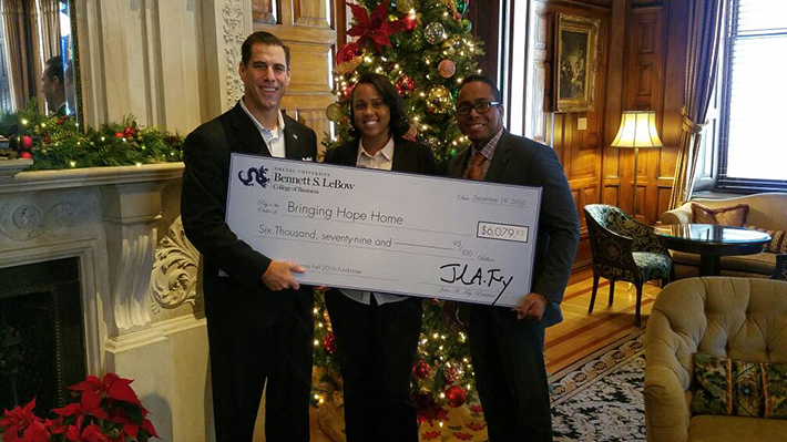 lebow presents check to bringing hope home