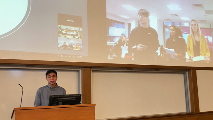 Student presenting with teammates on video conference