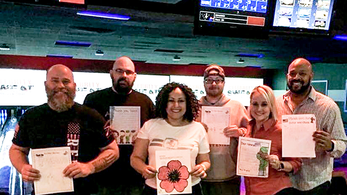 Daniel Pell poses with other volunteers