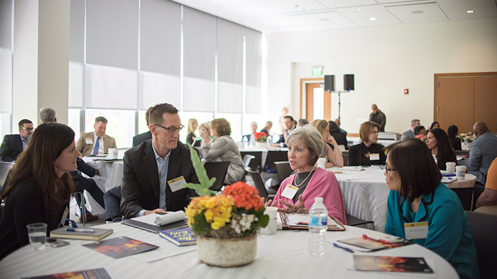 EMBA Summit Attendees Participate in Group Discussion