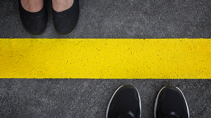 People divided by yellow line