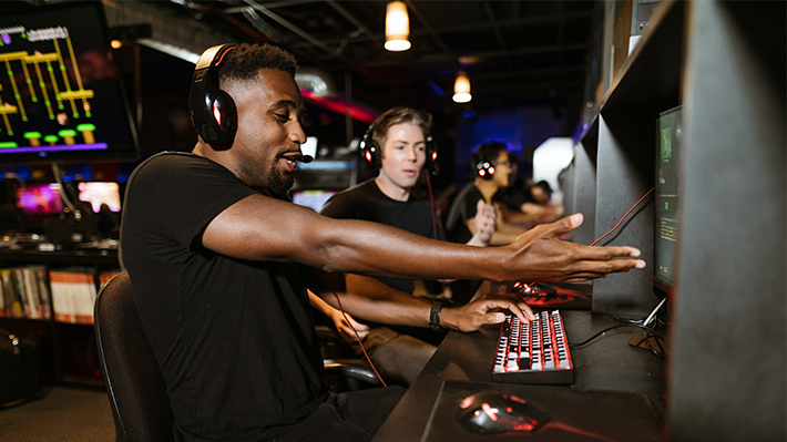 Two young men playing video games