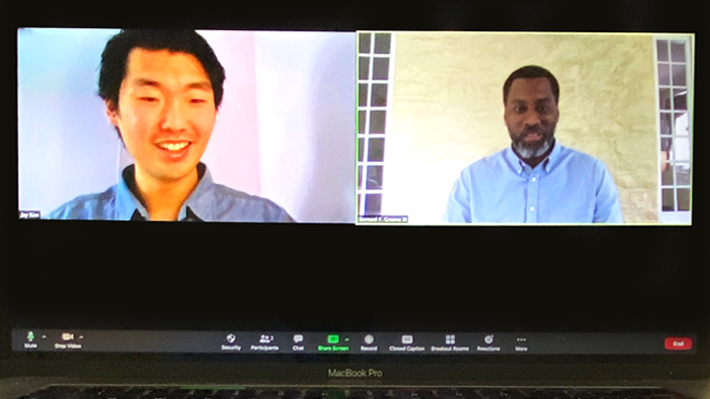 Two individuals on a computer screen in a virtual mentoring session via Zoom