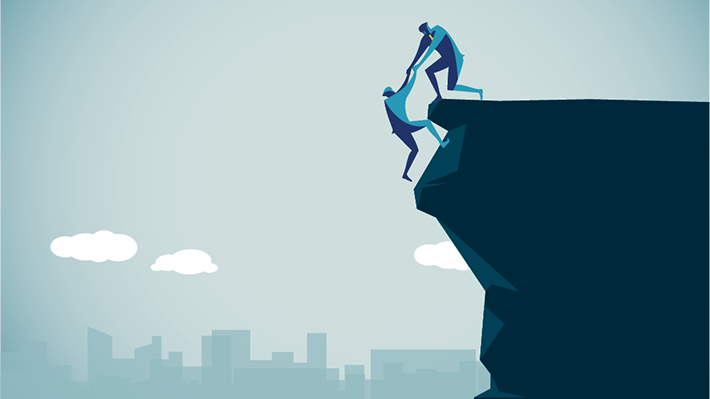 illustration of one person helping another climb a cliff 