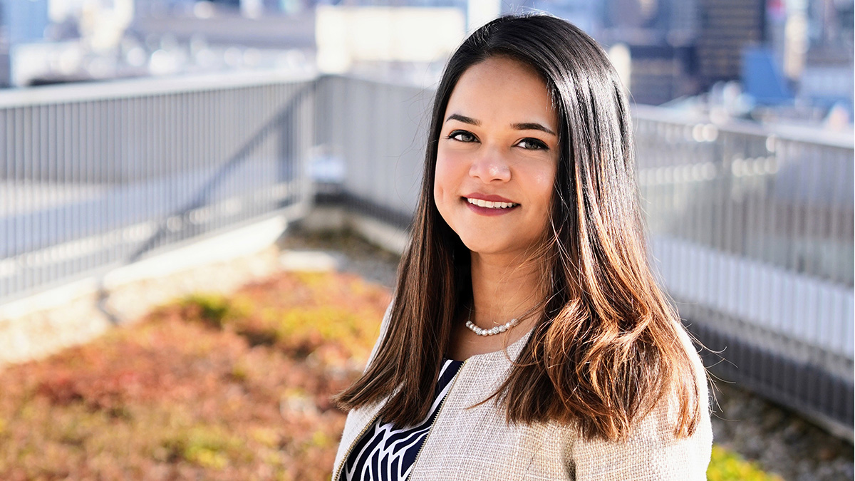 Mithila Guha, PhD candidate in marketing Woman in a white blazer standing outdoors