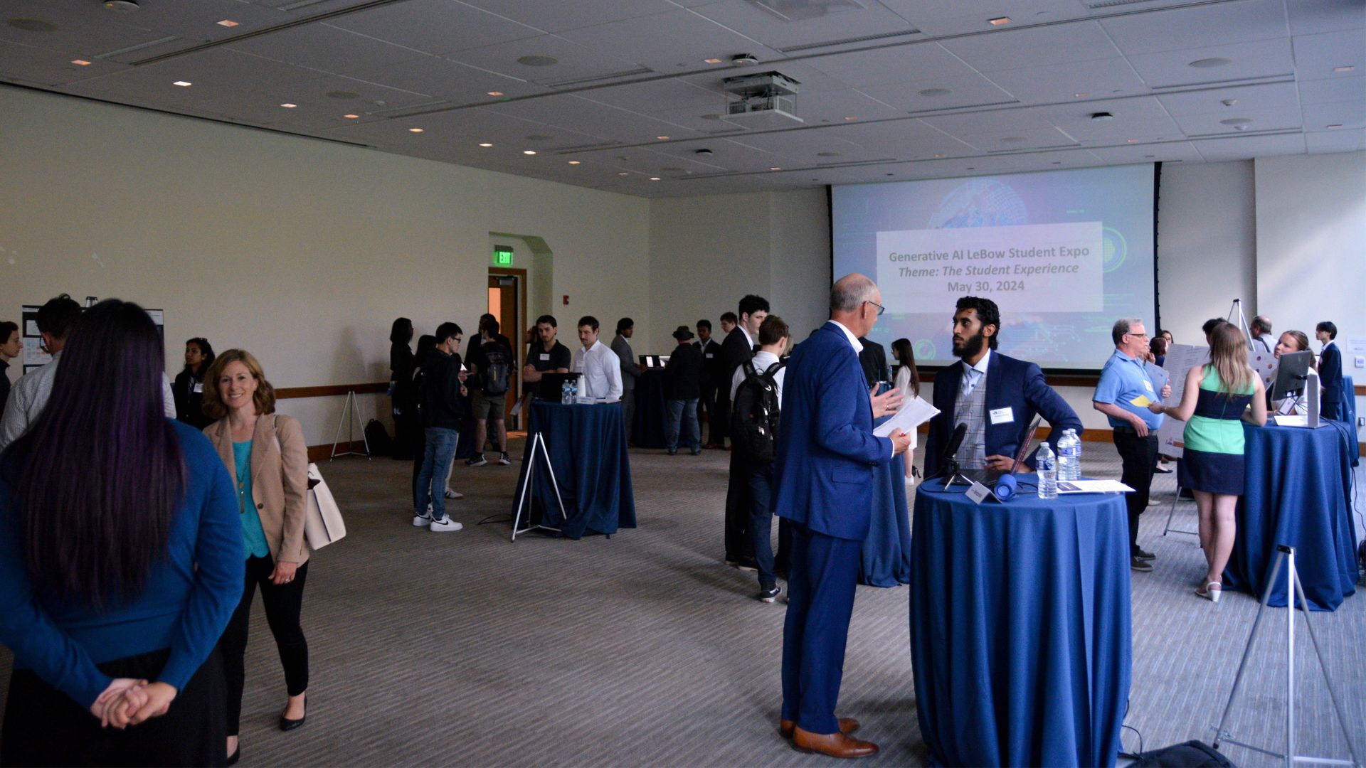 Generative AI Student Expo Wide Shot Students presenting products at the Generative AI Student Expo