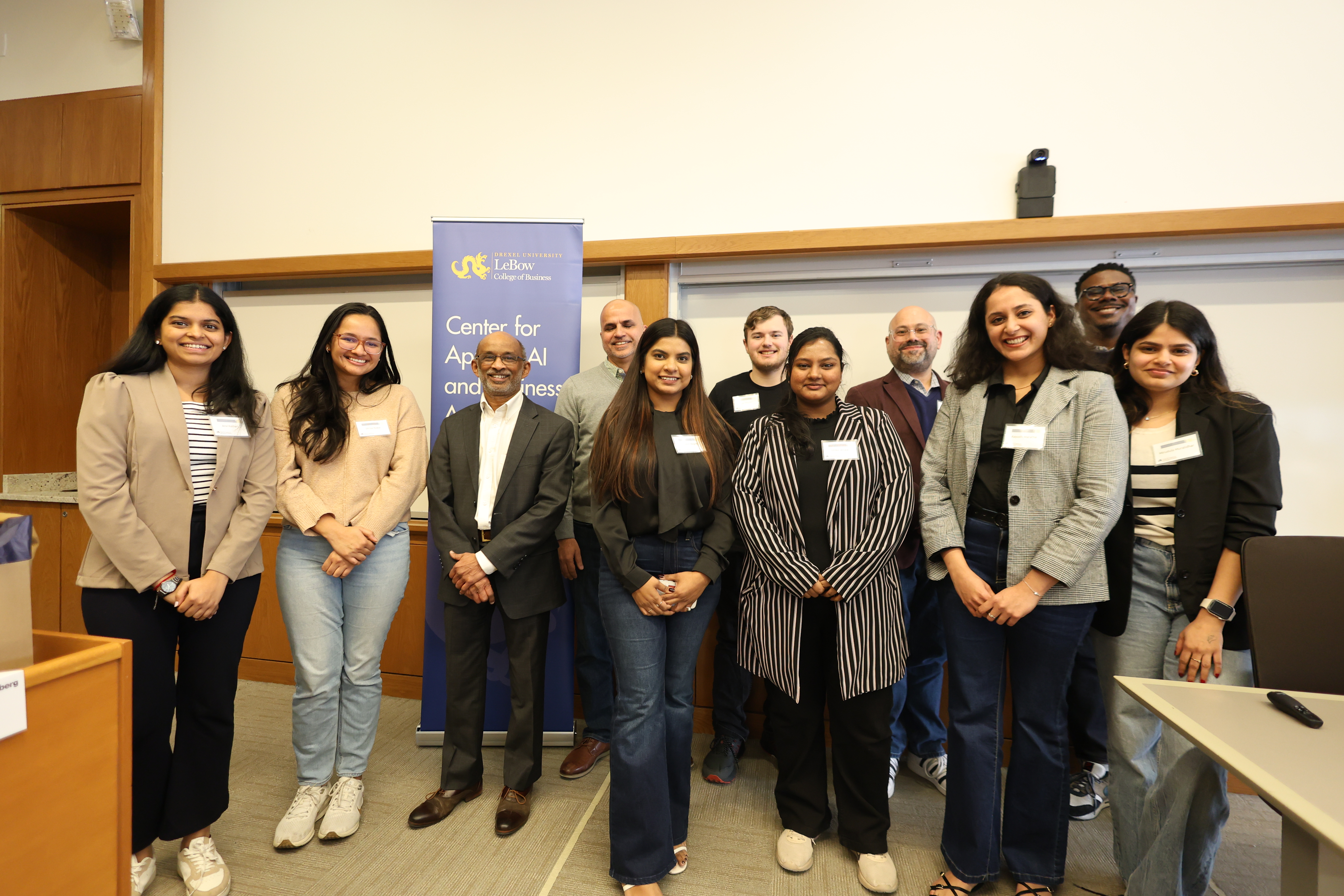 Winning students pose at graduate datathon