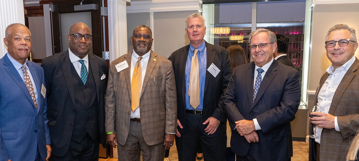 A group of male business leaders and executives in business attire