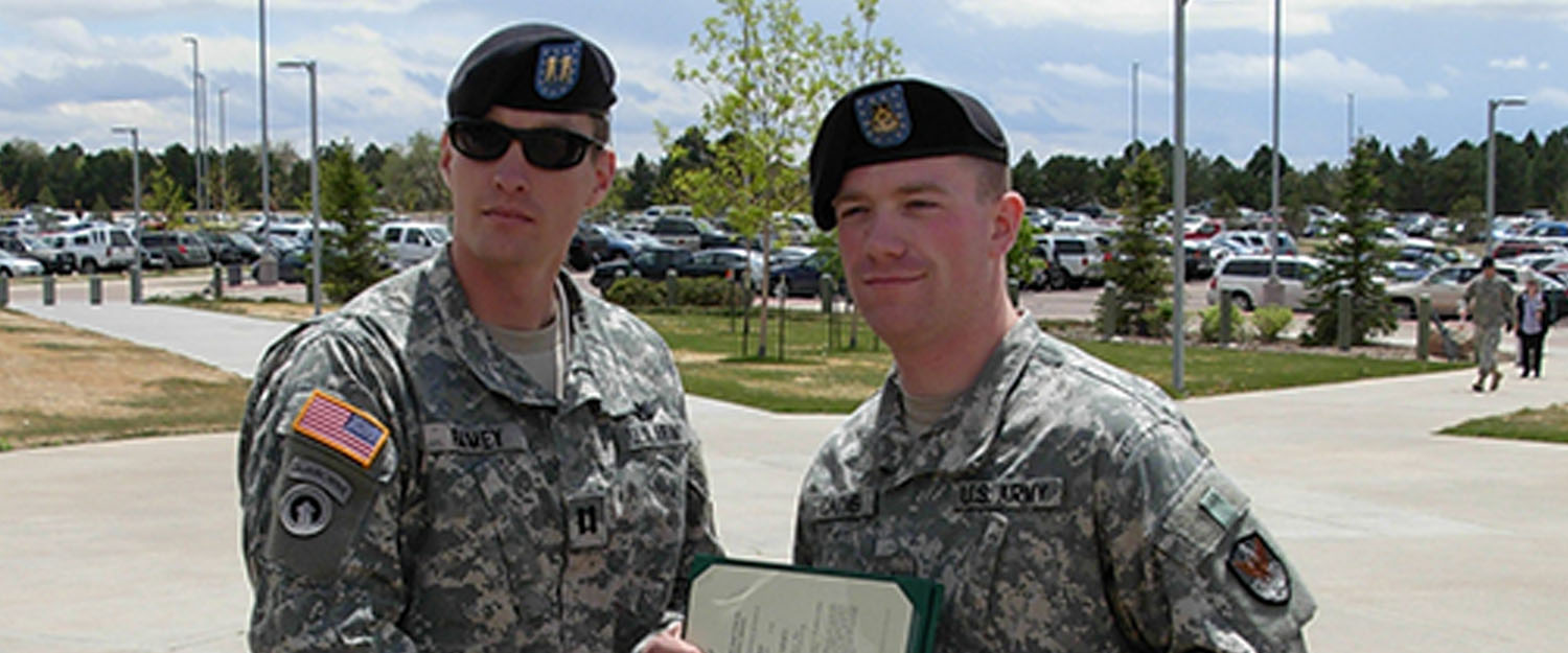Two U.S. Army servicemembers wearing the Army Combat Uniform