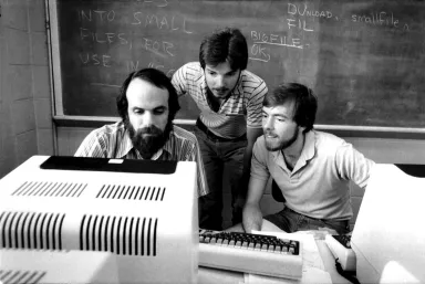 Archival Photo students looking at computer