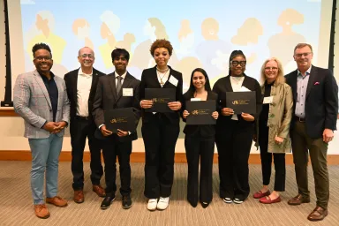 The 2023 Inclusive Impact Day Case Compition winners pose with a smile after their victory was announceed.