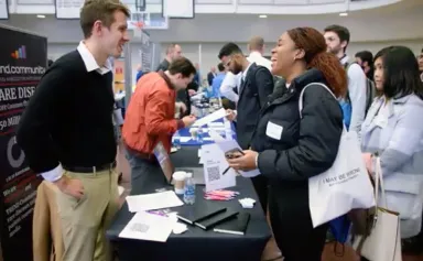 drexel students networking with potential employers at a career fair