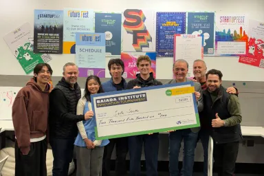 Winners of the Innovation Tournament pose with their check
