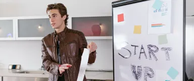 a student pitches their startup in the baiada institute