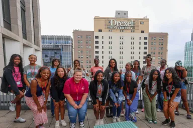 Girls in STEM participants take group photo on campus.