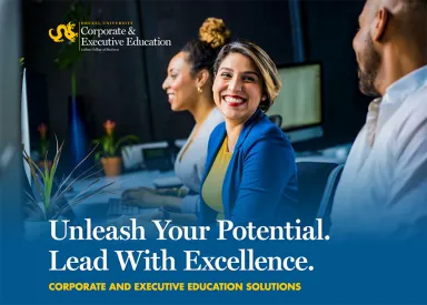 Coworkers in an office environment share smiles while exuding confidence