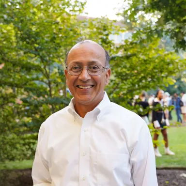 Dean Madan spending time with students during a Drexel LeBow BBQ.