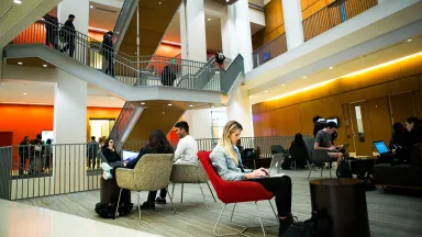 Drexel LeBow students studying in the atrium of Gerri C. LeBow Hall