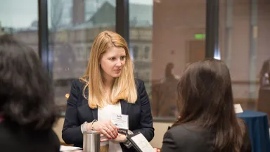 Two women have a conversation