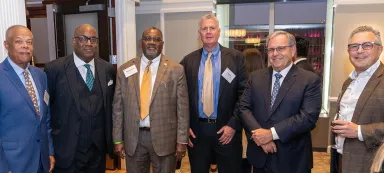 A group of male business leaders and executives in business attire