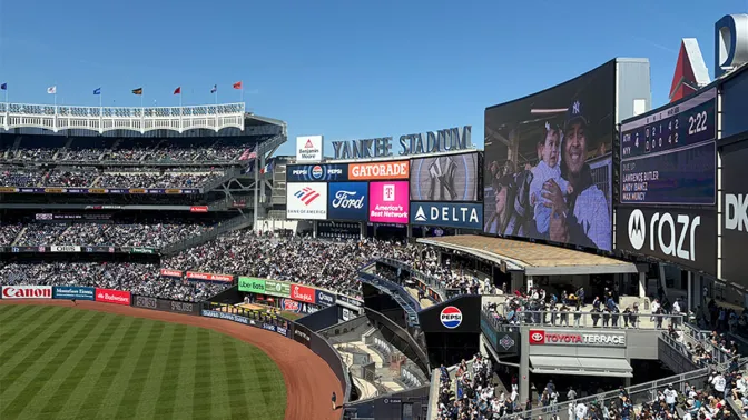 View of outfield of Yankee Stadium, with video board visible at the center