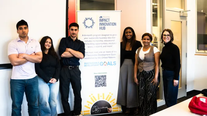 IIH participants next to IIH sign
