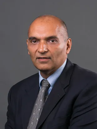 Headshot of Rajneesh Suri