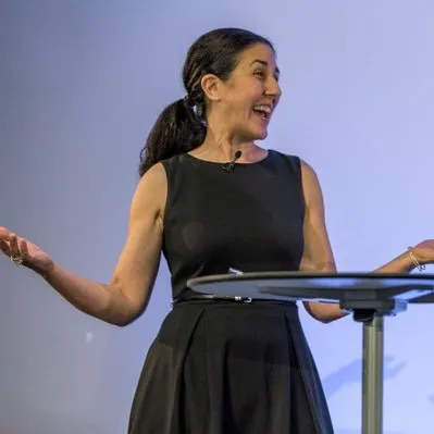 Photo of Mary Odabashian presenting at a conference