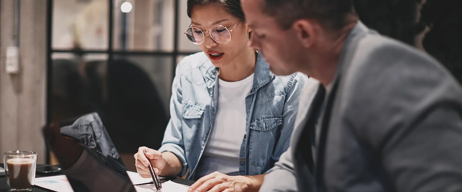 Two Students Discussing the Documents in Front of Them