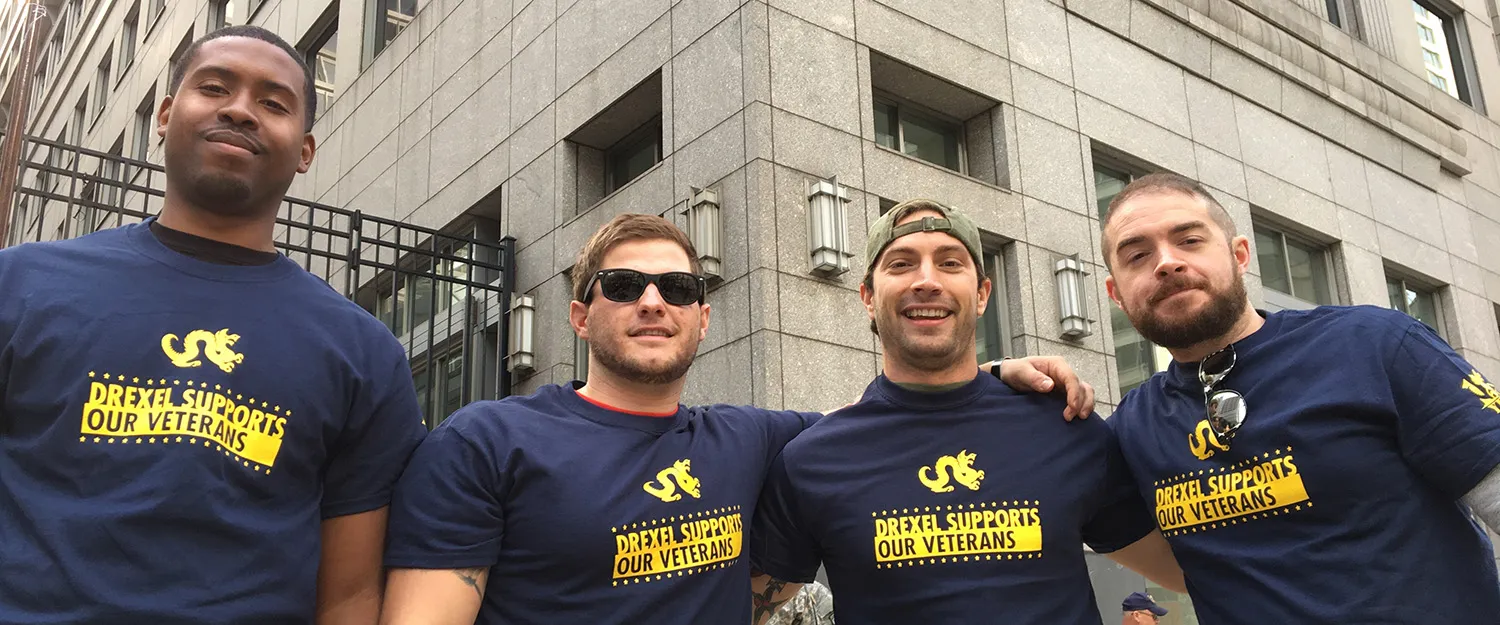 Drexel Veterans smile with their arms around each other, wearing shirts that read Drexel Supports Veterans.