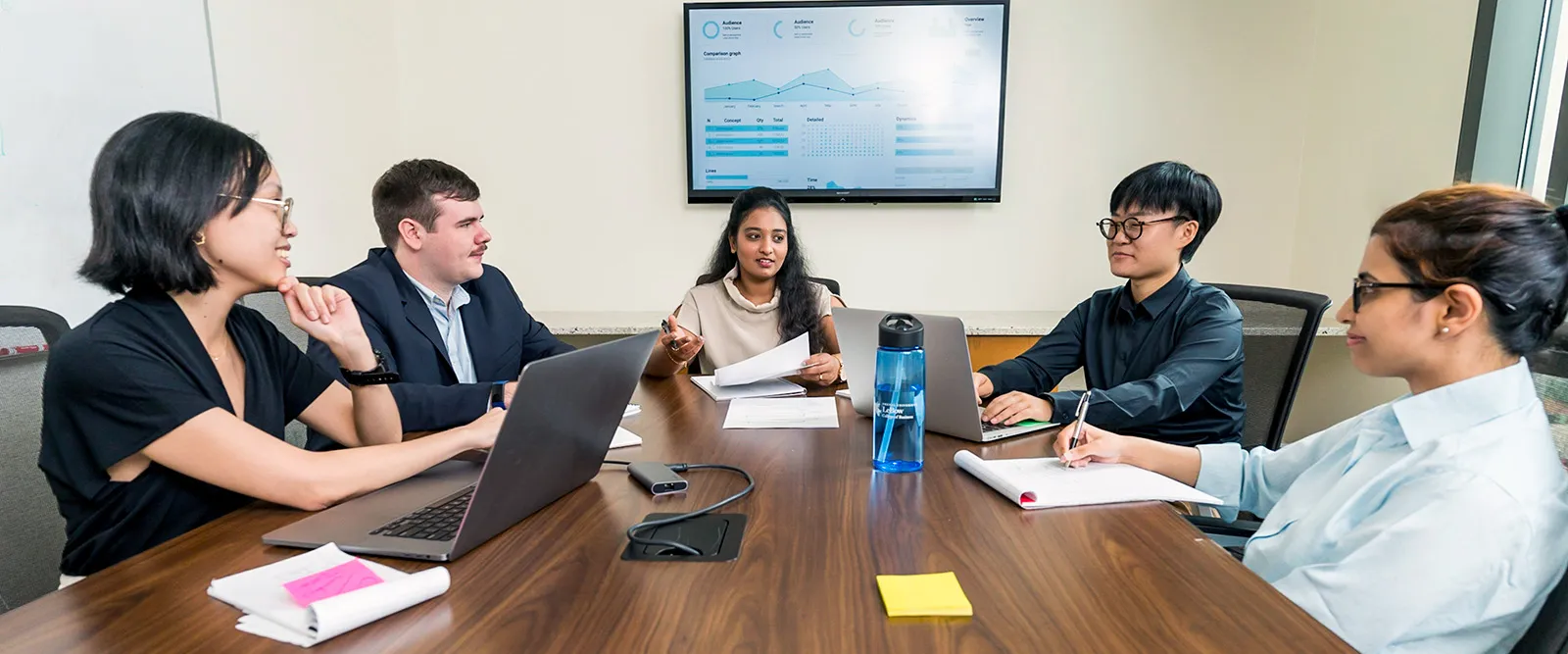 Students in discussion together in a classroom.