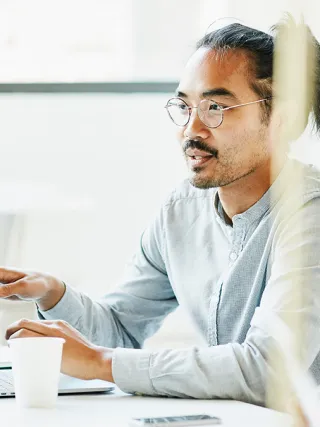 Business Analytics student in a meeting