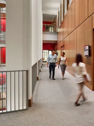 Gerri C. LeBow Hall staircase with faculty and students walking around