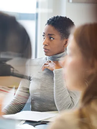 Woman listening in meeting