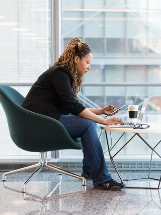 Woman working on laptop in office