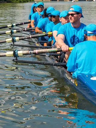 Executive MBA students rowing in Philadelphia as a team building exercise