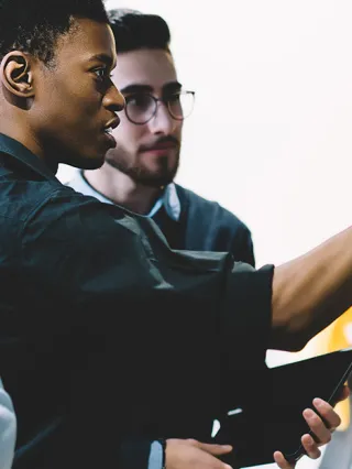 Graduate students consulting on a project