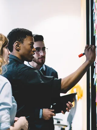 Graduate students consulting on a project