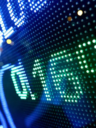 close up of a digital stock exchange ticker